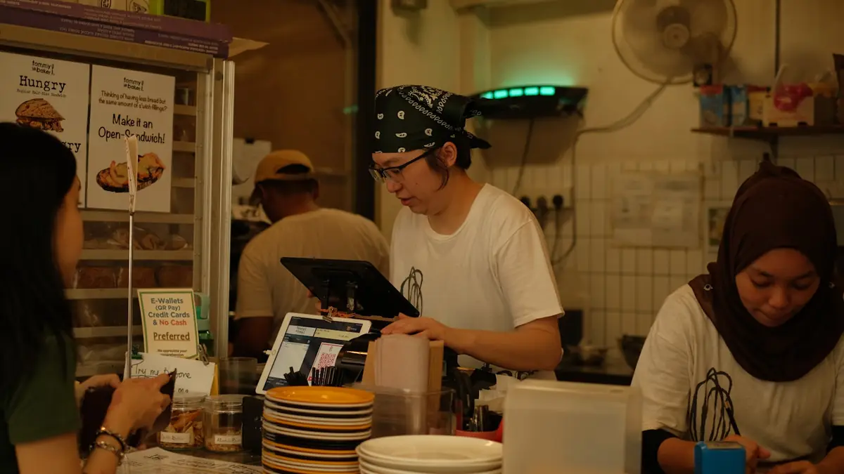 A group of people standing around a counter