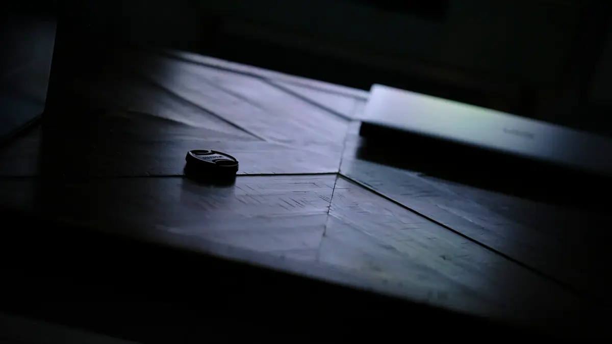 a cell phone sitting on top of a wooden table